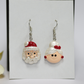 Santa Claus earrings on a white background
